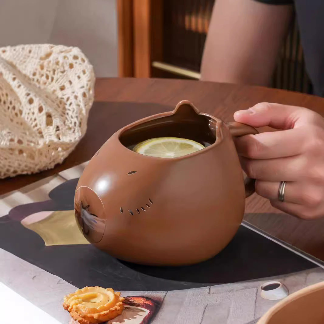 Capybara-shaped ceramic mug.